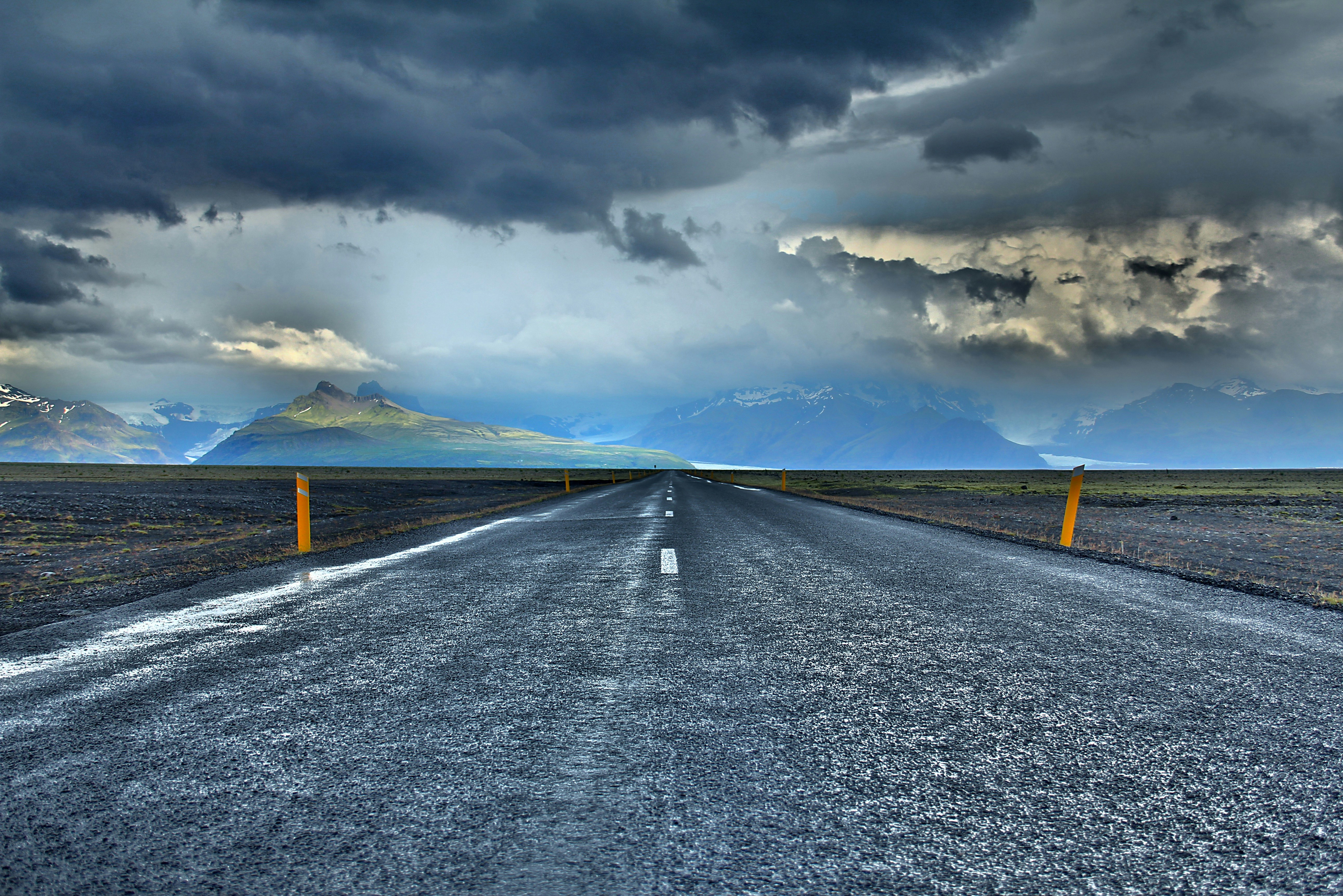 gray road under blue sky during daytime